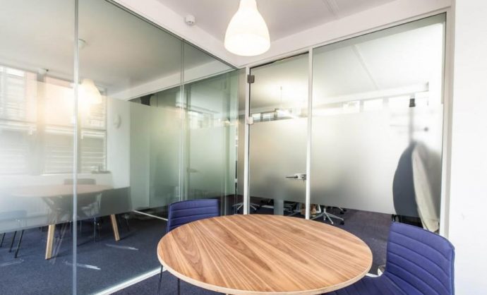 meeting room with glass walls by Kova Partitions