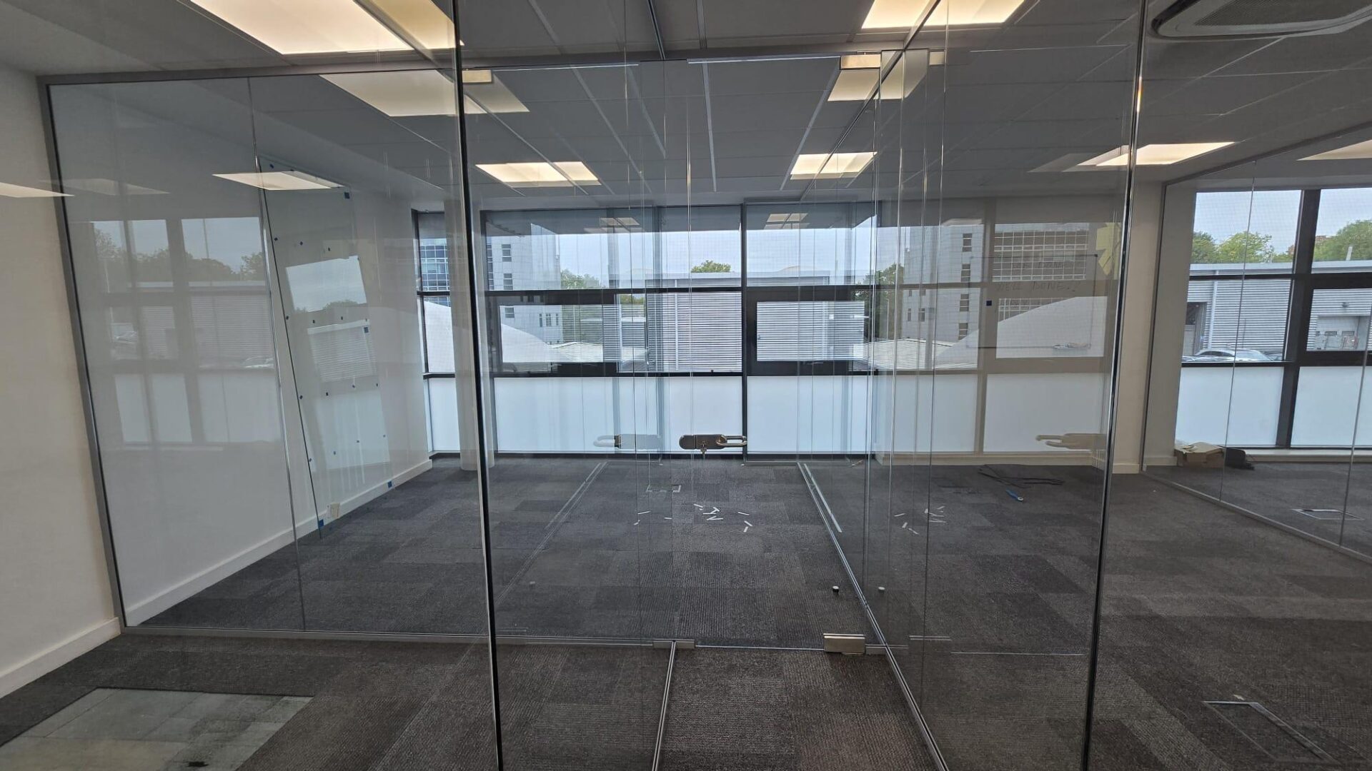 Framed glass partition